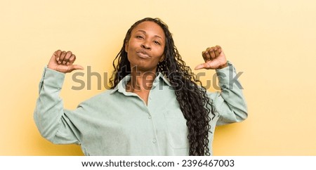 black pretty woman feeling proud, arrogant and confident, looking satisfied and successful, pointing to self Royalty-Free Stock Photo #2396467003