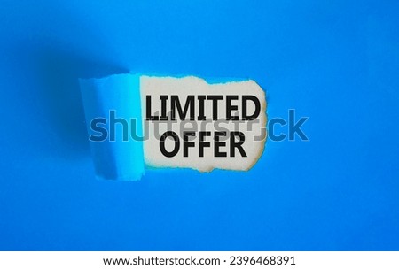 Limited offer symbol. Concept words Limited offer on beautiful white paper. Beautiful blue table blue background. Business marketing, motivational Limited offer concept. Copy space.
