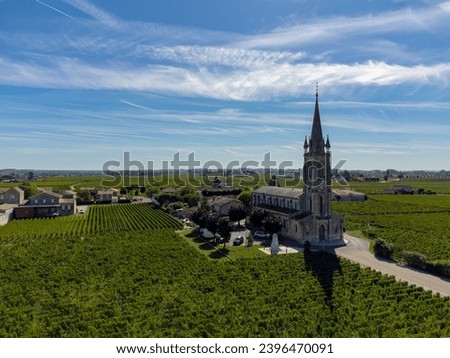 Aerial view on Pomerol village, production of red Bordeaux wine, Merlot or Cabernet Sauvignon red wine grapes on cru class vineyards in Pomerol, Saint-Emilion wine making region, France, Bordeaux Royalty-Free Stock Photo #2396470091