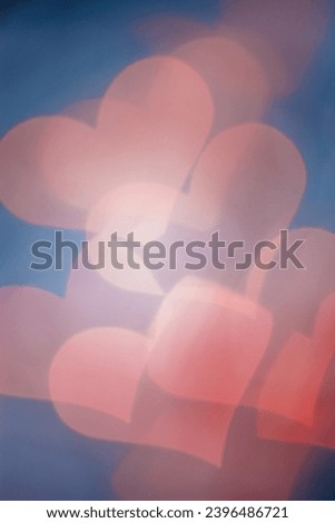 Defocused abstract bokeh background with hearts, flare from lights on blue, blurred bokeh holiday fon, celebration wallpaper. Love and romance aesthetic photo, glittering lights textured pattern