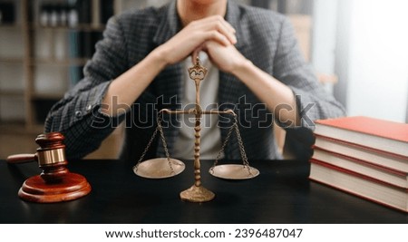 Male lawyer in the office with brass scale on wooden table. justice and law concept 
