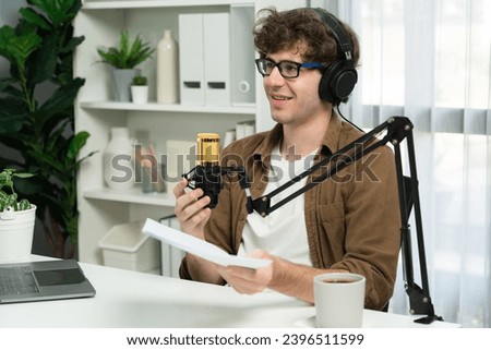 Host channel of influencer using headphone and mic talking with listeners on social media with laptop in life coaching and training marketing planning to customer target at studio office. Gusher.