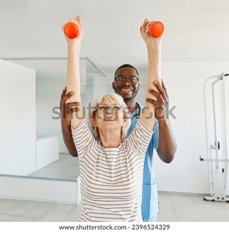 Doctor or nurse or physiotherapist caregiver exercise with senior woman at clinic or nursing home