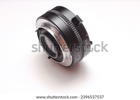 Power telecon lens, a lens used to extend the focal length of a camera.