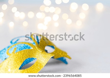 Carnival masks on a background with lights. Purim celebration concept. Space for text. High quality photo