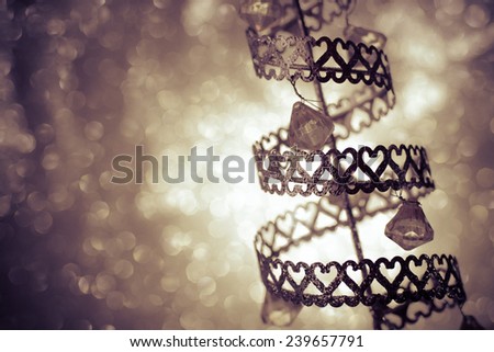 abstract of silhouette christmas tree with diamond hanging and bokeh background