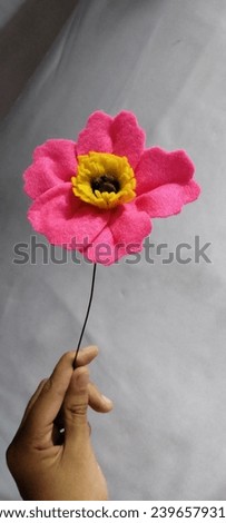 A stem of peony felt flower