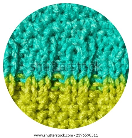 Pattern fabric made of wool. Handmade knitted fabric blue and green yellow wool background texture
