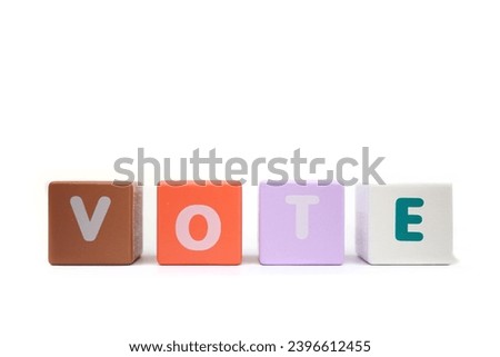 text VOTE on colorful wooden isolated on a white background.