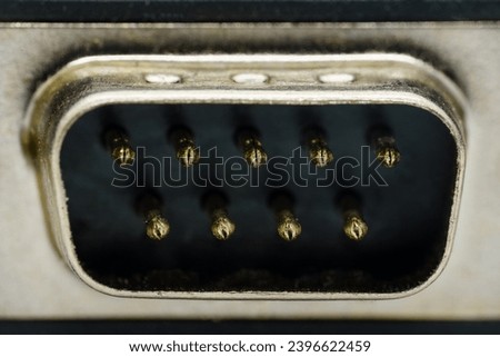 Male 9-pin serial port, macro close up Royalty-Free Stock Photo #2396622459