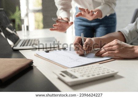 Business people study work with datasheets Royalty-Free Stock Photo #2396624227