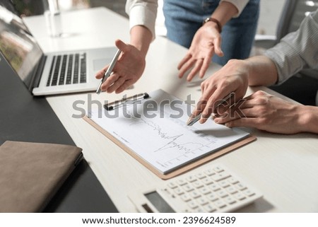 Business people study work with datasheets Royalty-Free Stock Photo #2396624589