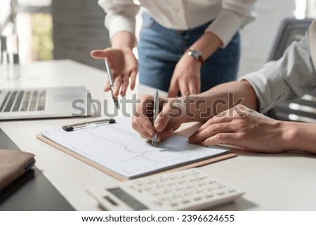 Business people study work with datasheets Royalty-Free Stock Photo #2396624655