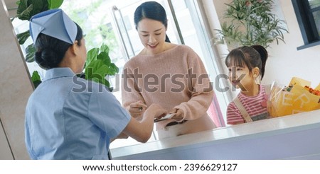 The young mother and daughter in the hospital and the nurse