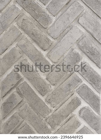 Grey beige chevron brick wall texture