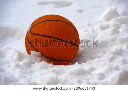 A basketball in the snow... the end of a season