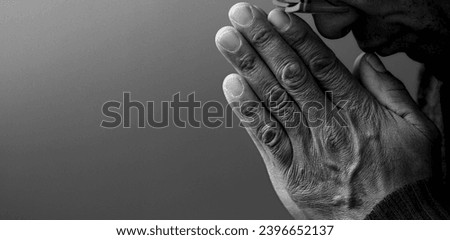 man praying to god on gray black background with people stock image stock photo