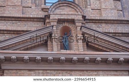 Sculpture of the goddess of justice Themis on the Court Building of the Eurasian Economic Union in Minsk Royalty-Free Stock Photo #2396654915