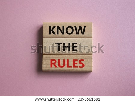 Know the rules symbol. Wooden blocks with words Know the rules. Beautiful pink background. Business and Know the rules concept. Copy space.