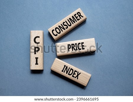 CPI - Consumer Price Index symbol. Concept word CPI on wooden blocks. Beautiful grey background. Business and CPI concept. Copy space. Royalty-Free Stock Photo #2396661695