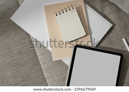 Aesthetic minimalist home office workspace. Blank copy space screen tablet pad, notebook sheets. Art, business template