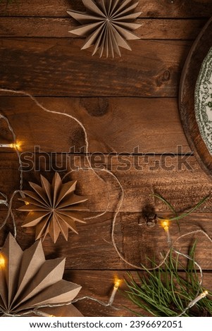 Christmas background with pine branches tree and decoration on dark wooden board. Flat lay. Space for text