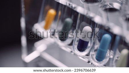 Extreme Close up of Test Tubes Filled with Pills and Drugs. Drugs Laboratory Concept.