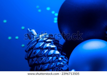 Christmas and New Year blue color baubles decoration background.  Art design backdrop with holiday balls. Beautiful Christmas ball closeup 