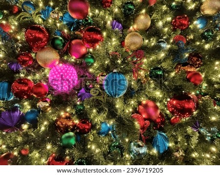 
Christmas design. Closeup of New Year tree with merry ornaments.