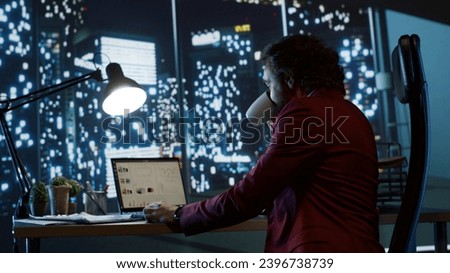 Company CEO thinking of ways to develop business globally, admiring city center view from his modern office building. Successful director analyzes monthly profit for development. Royalty-Free Stock Photo #2396738739