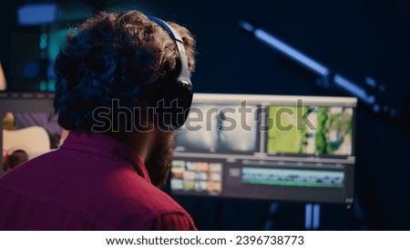 Video editor using editing software to upgrade footage shot, commissioned by production teams outsourcing tasks. Freelancer videographer finishing project in apartment studio