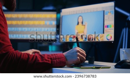 Expert photo editor browsing through photoshoot images to find and fix faulty spots using graphic tablet, close up. Photographer editing pictures with stylus on touchscreen device