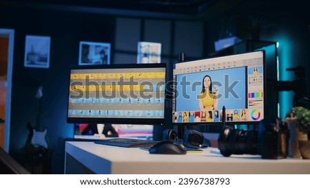 Empty media agency office with multi monitors setup used for post processing retouching of images. Editing software interface on computer screens in professional graphic design creative studio