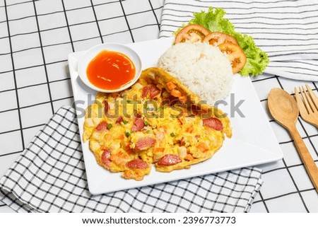 Omelet or omelet with rice and chili sauce Royalty-Free Stock Photo #2396773773