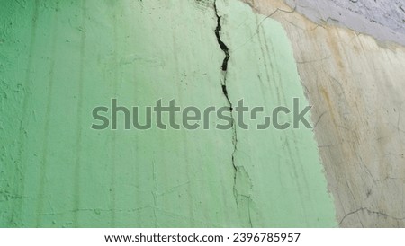 The wall has fine cracks on its surface. Suitable for illustrations of house building maintenance.