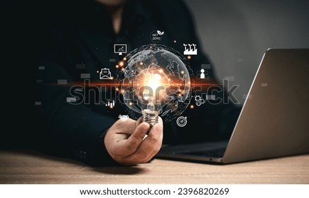 Businessman holding a light bulb. Big data. Online marketing Communication of business and organizational information. making expansion and financial plans. sales strategies and plans.