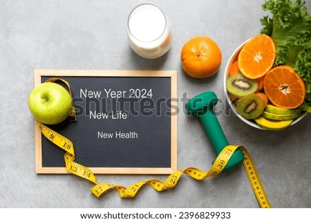 New Year for New Changes Healthy 2024.  Fresh vegetable fruits and healthy food for sport equipment for women diet slimming weight loss.  Healthy and Holiday Concept Royalty-Free Stock Photo #2396829933