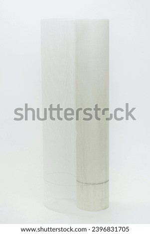 plaster mesh on a white background. fiberglass mesh for rough construction work on a light background. facade building mesh Royalty-Free Stock Photo #2396831705