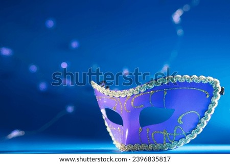 carnival mask on a blue background, masquerade ball