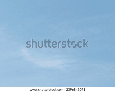 Beautiful blue sky with a little fluffy clouds. Close -up shot of the blue sky.