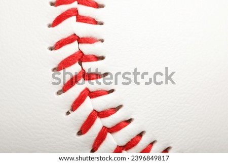 Baseball ball with stitches as background, closeup