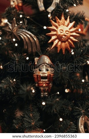 Retro miniature Christmas Soldier Nutcracker figurine. Christmas handmade souvenir. New Year's gifts and decorations for the winter holidays. Vertical