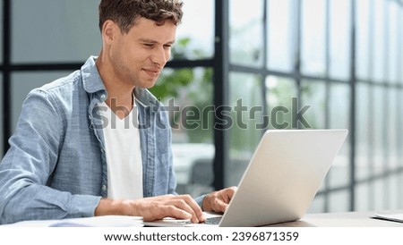 Businessman working on a laptop computer in the office