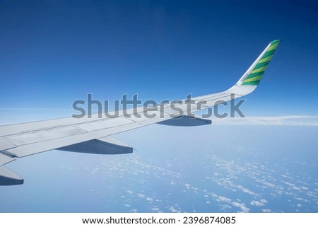 airplane window view to open space sky with horizontal copy space wings travel tourism air transport concept. Travel and tourism concept.