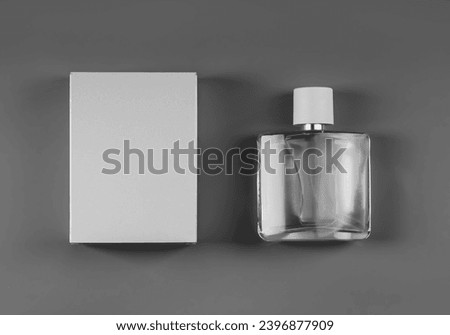 White packaging template, transparent bottle with perfume, cap, top view, box for design, branding. Product photo for advertising, presentation of scent. Cologne box mockup isolated on background Royalty-Free Stock Photo #2396877909