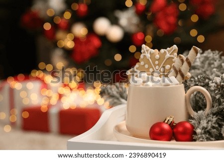Delicious cocoa with marshmallows, wafer sticks and gingerbread cookie with Christmas decorations on white tray, space for text Royalty-Free Stock Photo #2396890419