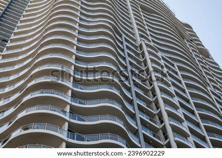 Modern apartment building with curvy lines in Brisbane, Australia. Royalty-Free Stock Photo #2396902229