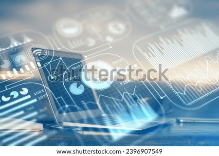 Computer on desktop in office with technology theme hologram. Multi exposure. Tech concept. Royalty-Free Stock Photo #2396907549