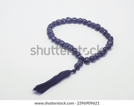 Unique prayer beads made from banana seeds isolated on a white background