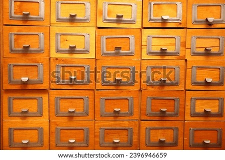 Library card catalog drawers as background, closeup Royalty-Free Stock Photo #2396946659